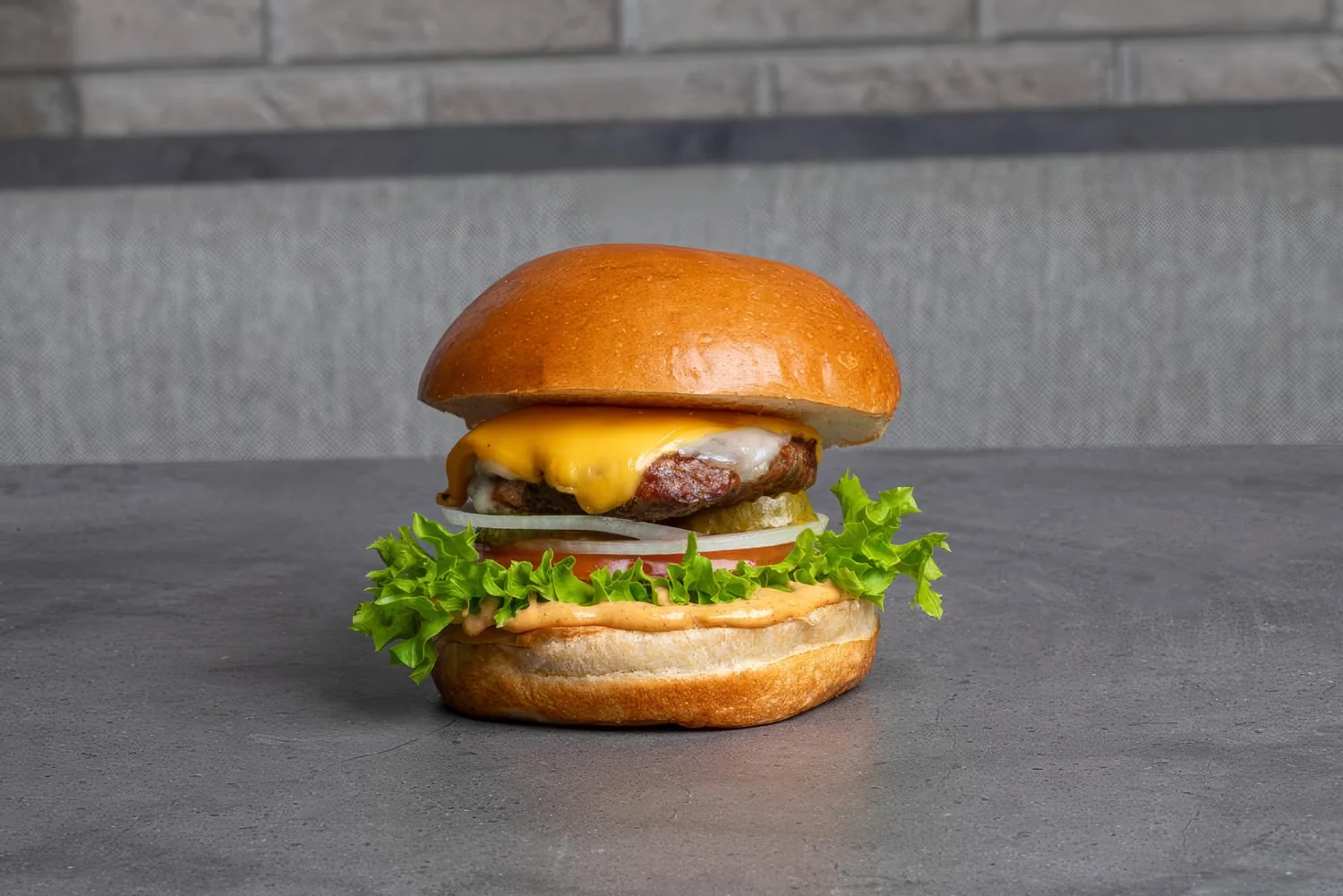 The original Bash Burger with cheddar, Swiss cheese, vegetables and Bash sauce