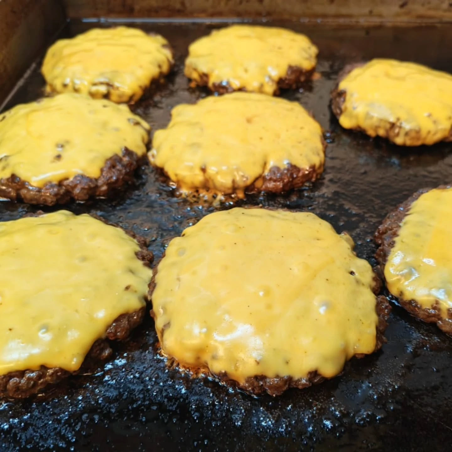 Prime burgers on the grill from Brisket Instagram